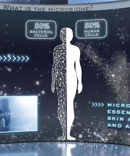 A futuristic display explaining the microbiome, highlighting that the human body consists of 50% bacterial cells and 50% human cells. Text emphasizes the importance of the microbiome for skin health and appearance.