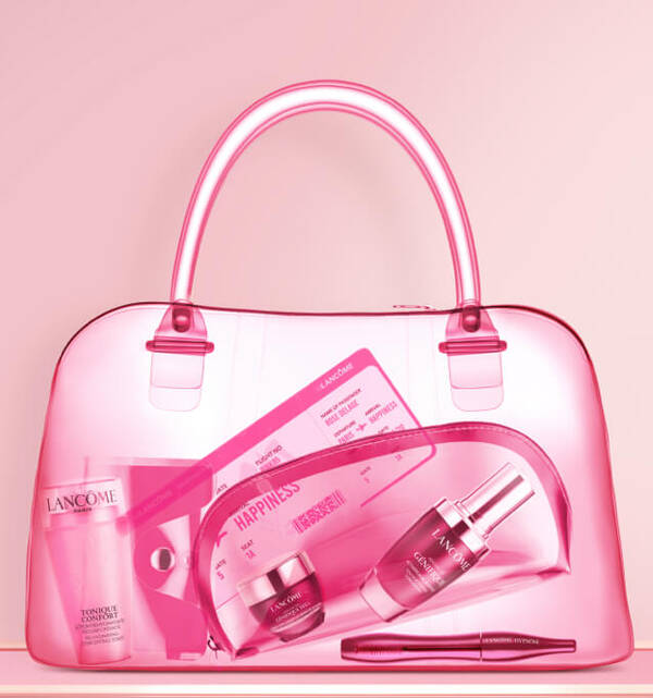 A transparent pink handbag featuring various Lancome beauty products, including skincare and a card labeled "HAPPINESS."